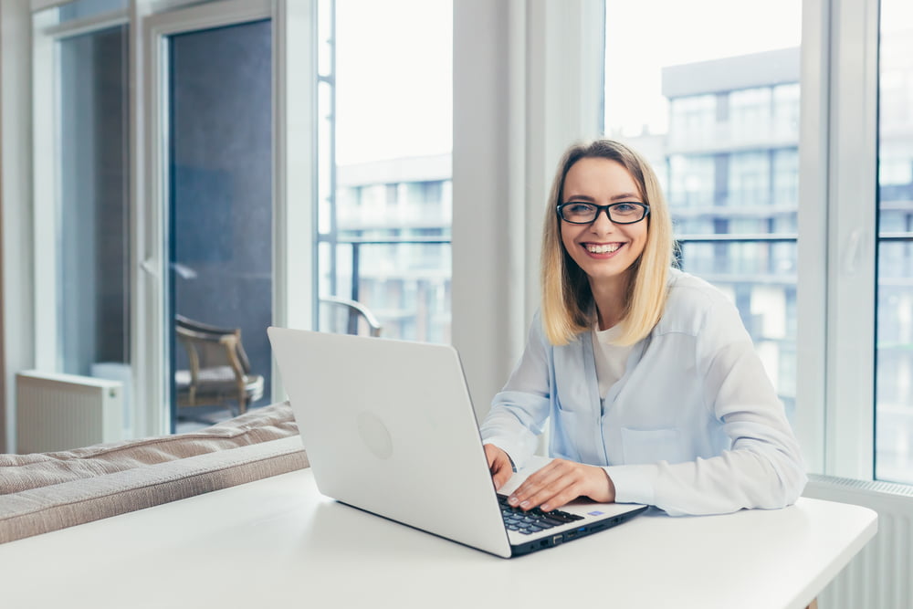 Working woman wearing glasses - Diabetic Eye Exam in Costa Mesa, CA Working woman wearing glasses - Diabetic Eye Exam in Costa Mesa, CA